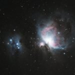 Capture of the Orion Nebula (M42) with stars and galaxies in a celestial scene.